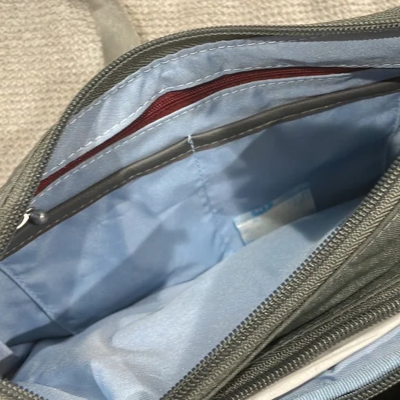 Baggallini. Brand new with tags. Grey with subtle cheetah print background. - Picture 11 of 12